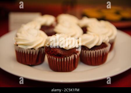 red velvet cupcakes being served at an event Stock Photo