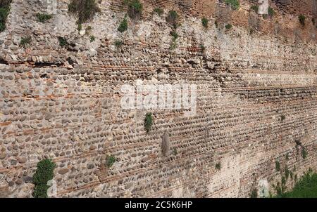 old red bricks and stones wall useful as a background Stock Photo