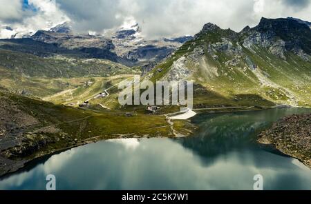 Landscape with mountain lake in Alps Stock Photo