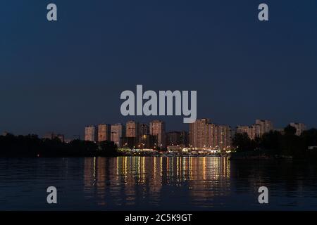 Evening at Dnipro River. View on Poznyaki district at left side of Dnieper. August, 2019. Kiev, Ukraine Stock Photo
