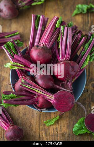 Fresh red organic beets on a wooden table Stock Photo