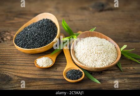Black and white sesame seed in the wooden bowl Stock Photo