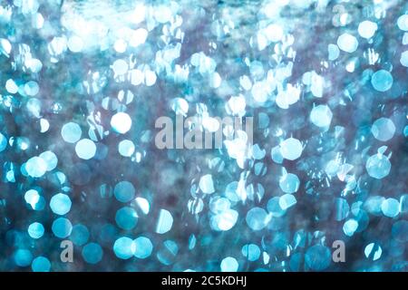 Bokeh Background.Christmas blue lights.abstract ,winter white glitter,diamonds shine,blur background with defocus Stock Photo