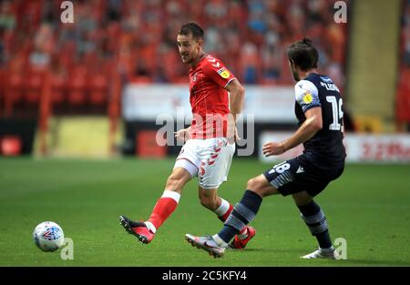 Charlton Athletic's Tom Lockyer (left) and Millwall's Ryan Leonard battle for the ball during the Sky Bet Championship match at The Valley, London. Stock Photo