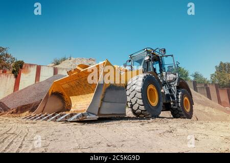 excavator or bulldozer on construction site - Stock Photo