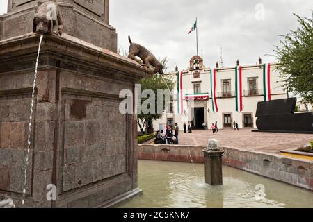 Fuente de los Perritos or Puppy Fountain outside the government palace or Palacio de Gobierno along the Plaza de Armas in the old colonial section of Santiago de Queretaro, Queretaro State, Mexico. Stock Photo