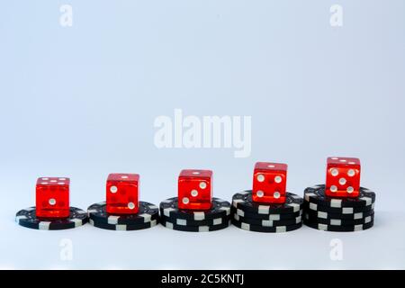 Casino chips stairs with glass dices Stock Photo