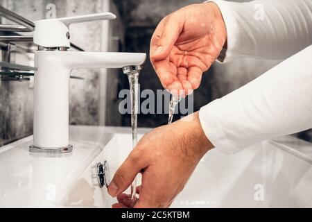 Coronavirus. Proper washing and handling of hands. Liquid antibacterial soap. Self-isolation and hygiene. Stock Photo