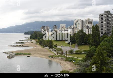 A view over the beaches at Sunset Beach Park  and of English Bay and the apartment and condominium buildings in the West End district in Vancouver, Br Stock Photo