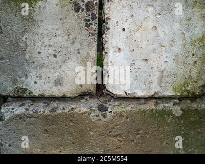 Texture of an old wall made of gray concrete blocks. Stock Photo
