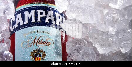 POZNAN, POL - MAY 28, 2020: Bottle of Campari, an alcoholic liqueur containing herbs and fruit (including chinotto and cascarilla), invented in 1860 b Stock Photo