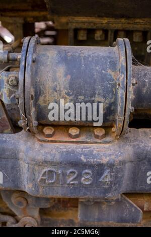 Rusty old valves, gauges and metal parts on an antique steam locomotive ...