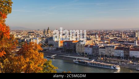 View of Budapest and the river Danube from the Citadella, Hungary at sunrise with beautiful autumn foliage Stock Photo