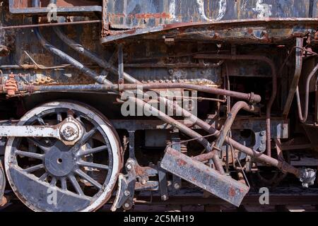 Rusty old valves, gauges and metal parts on an antique steam locomotive ...
