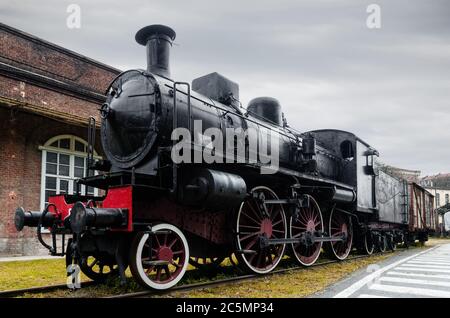 Italian steam locomotive in the station of Turin Ponte Mosca