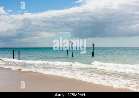 Cruise ship anchored off the coast of the Isle of Wight during the coronavirus outbreak in 2020 as seen from Branksome Chine Beach, Poole, Dorset, UK Stock Photo