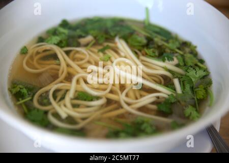 vegan Pho vietnamese soupe with noodles bowl close-up. Healthy and vegetarian food concept Stock Photo