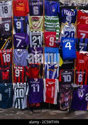 Football jerseys with names of football players for sale at sales stall,  Florence, Italy Stock Photo - Alamy