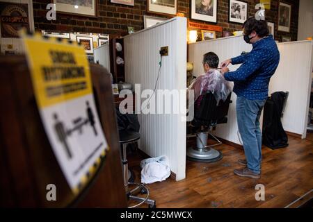 The first customers at the reopening of Jakes Barbers in Birmingham, as coronavirus lockdown restrictions are eased across England.