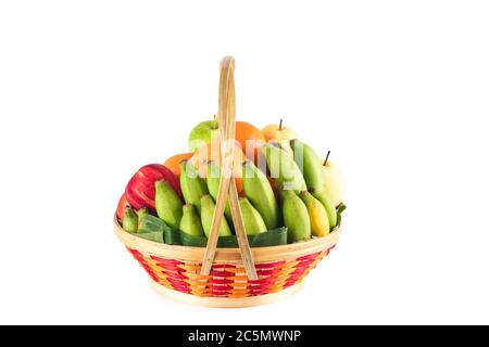 fresh orange, Chinese pear, banana, green apple and red apple in bamboo wicker basket on white background fruit health food isolated Stock Photo