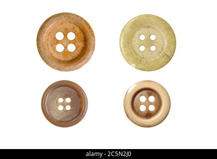 Four different sewing buttons for clothes isolated on white background. Stock Photo