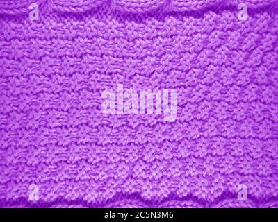 Close up of woolen knitted texture - Violet Stock Photo