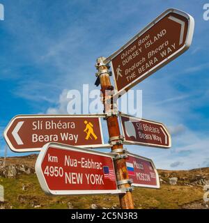 Sign post  in Irish Gaelic and English languages at Dursey Island cable car station on the Beare Peninsula, the Ring of Beare, County Cork, West Cork, Stock Photo