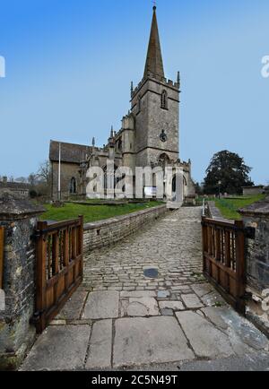 Outside the gates of St Cyriac's Church in Lacock village Wiltshire Stock Photo