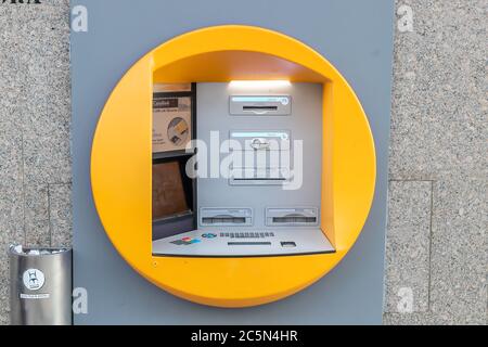 Punta Umbria, Huelva, Spain - June 3, 2020: ATM machine of CaixaBank bank in the street Calle Ancha in Punta Umbria Stock Photo