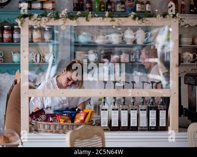 Rochester, Kent UK. 4th July, 2020. A cafe, Fleur de Thé., in Rochester High Street welcomes customers again. The U.K reopens pubs, restaurants, barbers, hairdressers and hotels on July 4th after being closed since March due to the Coronavirus Outbreak. Credit: Yousef Al Nasser/ Alamy Live News Stock Photo