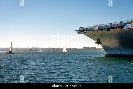 View of the San Diego bay with sailing boats and the prow of the UUS Midway. Stock Photo