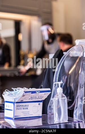 Harrogate, North Yorkshire, UK. 4th July, 2020. Hugo Wragg from Steca N.6 barber shop, at work wearing full PPE as barbers reopen to the public on Super Saturday. Credit: ernesto rogata/Alamy Live News Stock Photo