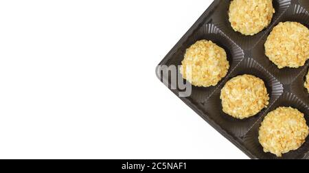 Sweet chocolate balls in plastic package. Yellow candy pralines. Template/mockup image Stock Photo