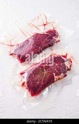 Beef rump steak pack set, on black dark stone table background, top ...