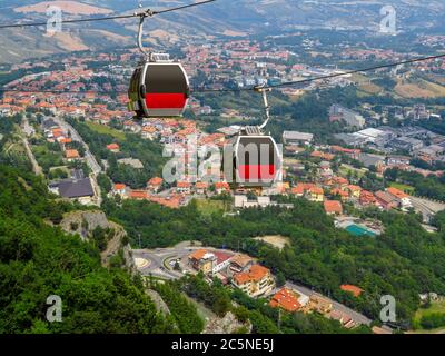 Two cabins of the funicular over the village from the fortress of San Marino Stock Photo