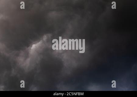 gray incoming storm clouds dark closeup backdrop Stock Photo