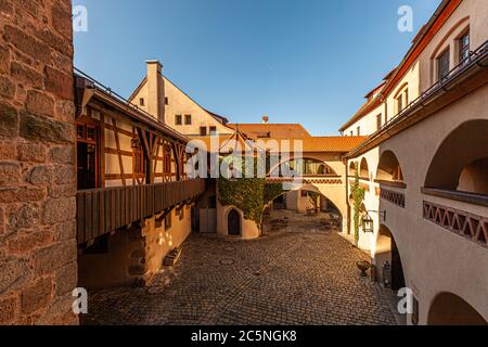 A castle courtyard - as it should be - with turrets, arches and hidden corners in Wernberg-Köblitz, Germany Stock Photo
