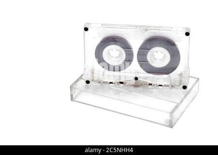 magnetic tape cassette standing on a case isolated on a white background, copy space. Stock Photo