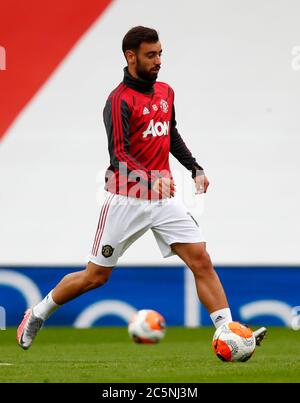Manchester United's Bruno Fernandes warms up prior to the Premier League match at Old Trafford, Manchester. Stock Photo