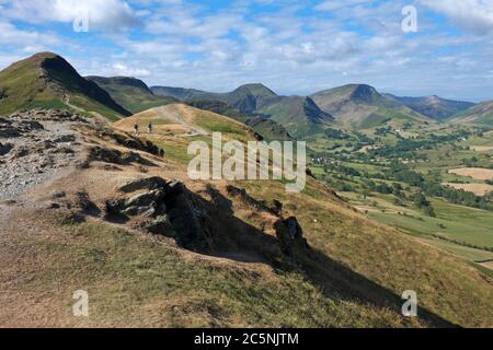 Looking towards the head of the Newlands Valley from the eroded ridge path leading up to the popular Lake District summit of Cat Bells Stock Photo