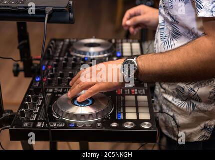 DJ hand in the work process close up Stock Photo