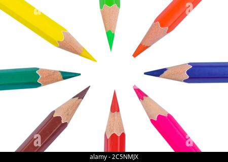 Round circle made with eight different colored wood pencil crayons on a paper background Stock Photo