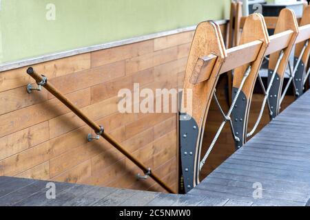 The exterior of the entrance to the restaurant in the basement is stylized under the sea theme of the ship's deck of wooden planks and ropes. Stock Photo