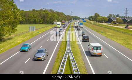 Motor Traffic on the A1 Motorway seen from above. This is one of the Bussiest highways in the Netherlands Stock Photo