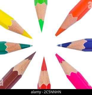 Circle made with eight different colored wood pencil crayons on a paper background Stock Photo