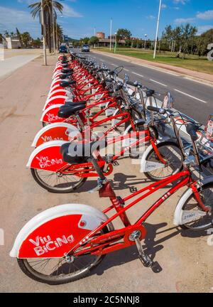 BARCELONA, SPAIN - JULY 13, 2016: Bicycles on a street of Barcelona. Bicing is the name of a bicycle sharing system in Barcelona inaugurated on March Stock Photo