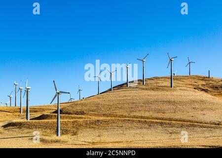 Wind turbines on the hills at Altamont Pass, in California, with morning light Stock Photo