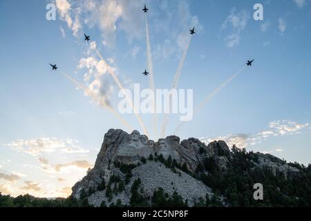 In this photo released by the United States Department of Defense (DoD), Blue Angels F-18 Hornets fly over Mount Rushmore during a Salute to America celebration hosted by the state of South Dakota July 3, 2020. The Blue Angels, based out of Naval Air Station Pensacola, Fla., were part of the DoD's participation that also included aerial flyovers by the B-1B Lancer from the 28th Bomb Wing, Ellsworth Air Force Base; South Dakota Air National Guard F-16s Falcons from the 114th Fighter Wing, Sioux Falls; and HH-60s Black Hawk helicopters from Company C, 1-189th Aviation Regiment, in Rapid City, S Stock Photo
