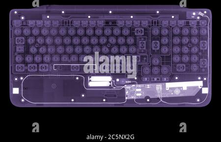 Computer keyboard, coloured X-ray. Stock Photo