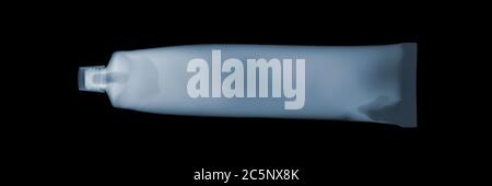 Toothpaste tube, coloured X-ray. Stock Photo